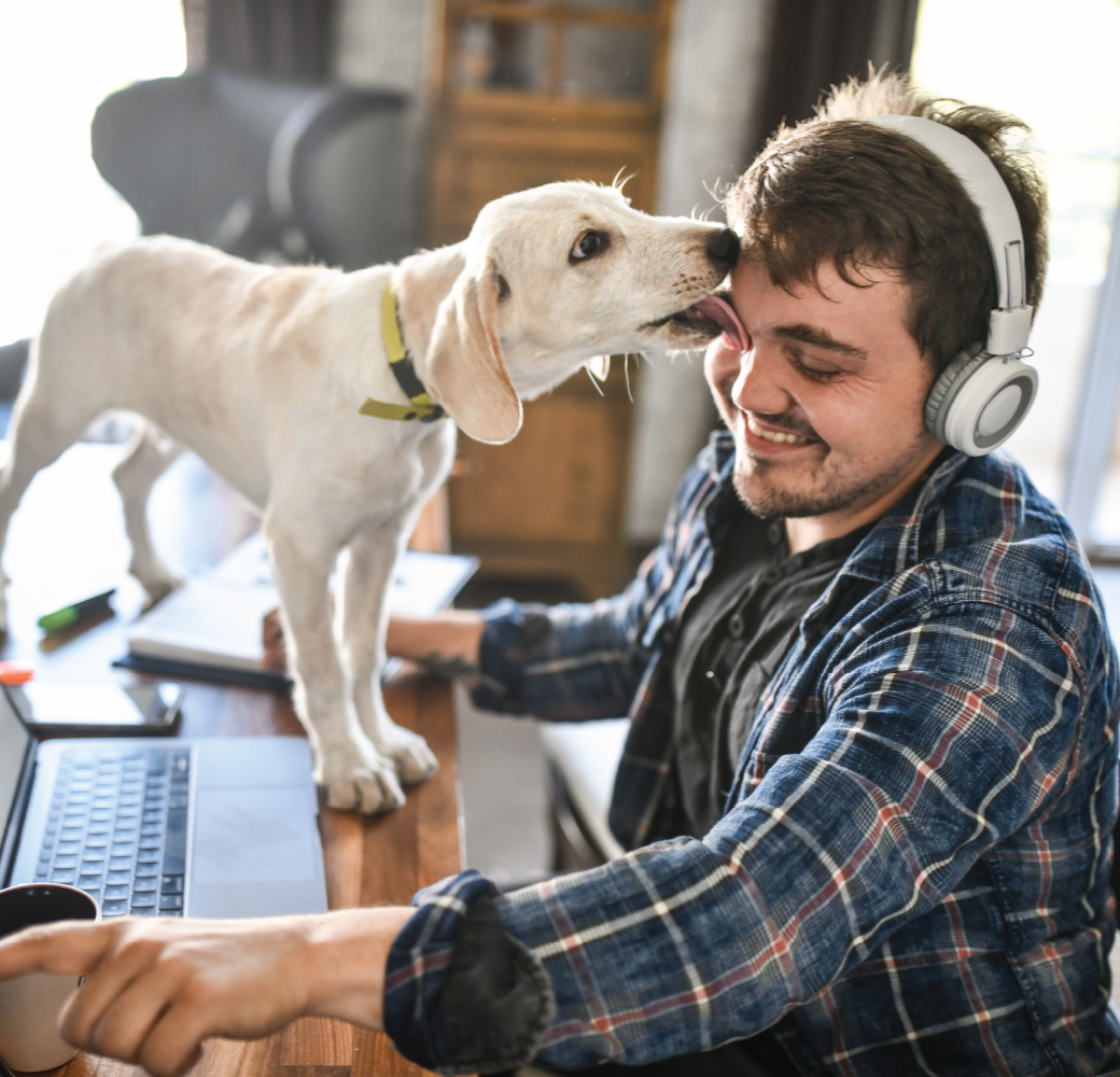 Savings 101-man in headphones getting licked by dog